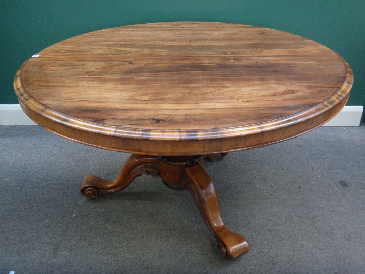 Appraisal: A mid- th century rosewood breakfast table the circular snap