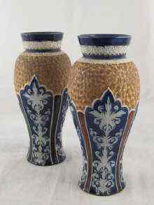 Appraisal: A pair of Lambeth Doulton vases the blue panels with