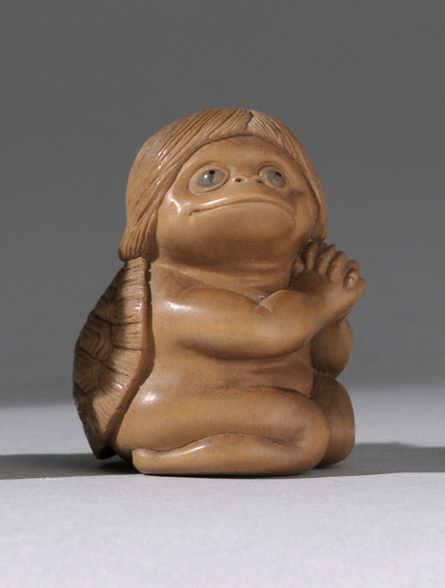 Appraisal: WOOD NETSUKE ContemporaryBy Kozan Depicting a kneeling kappa with inlaid