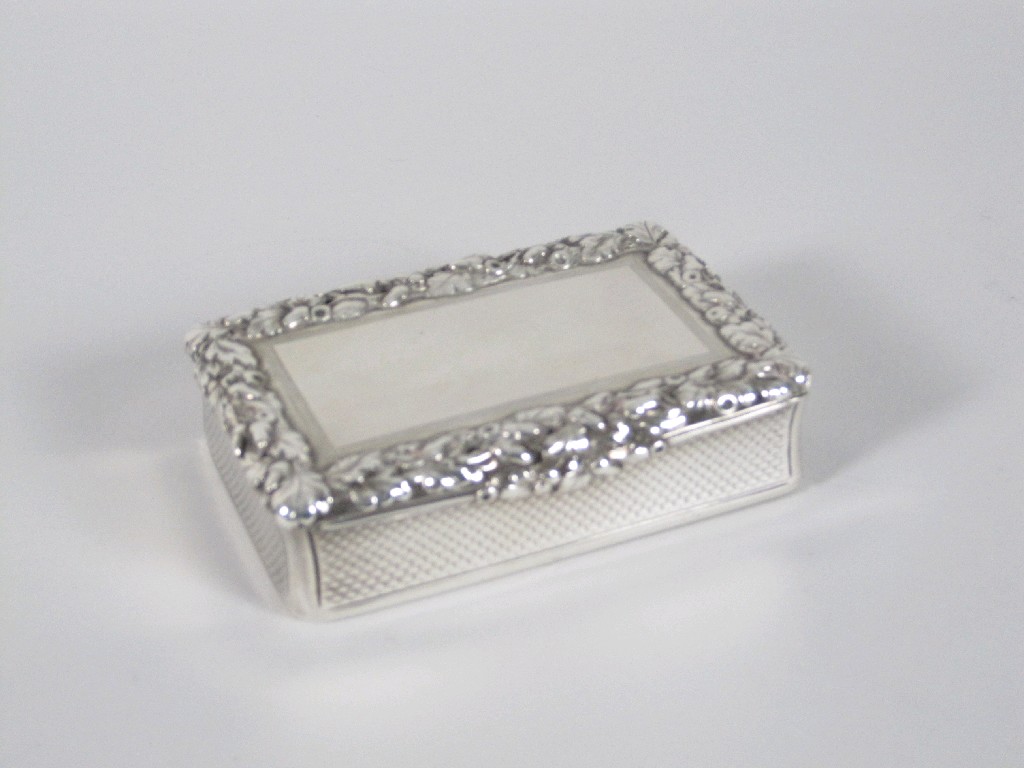 Appraisal: A Victorian oblong Snuff Box with cast floral and leafage