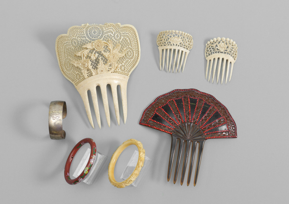 Appraisal: COLLECTION OF IVORY HAIR COMBS MORE pieces total to include