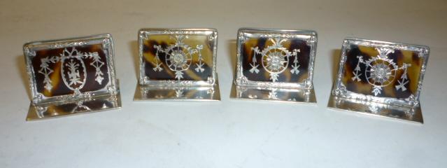 Appraisal: A SET OF FOUR EDWARDIAN TORTOISESHELL MENU HOLDERS maker William