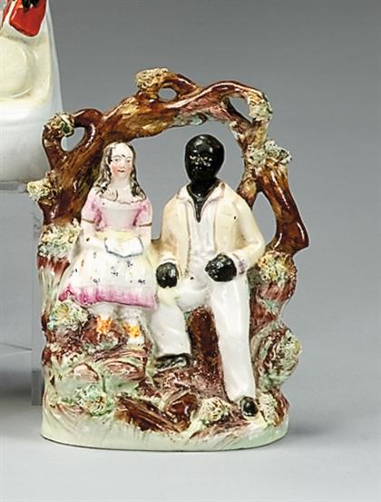 Appraisal: Staffordshire polychromed figural group of Uncle Tom and Eva second