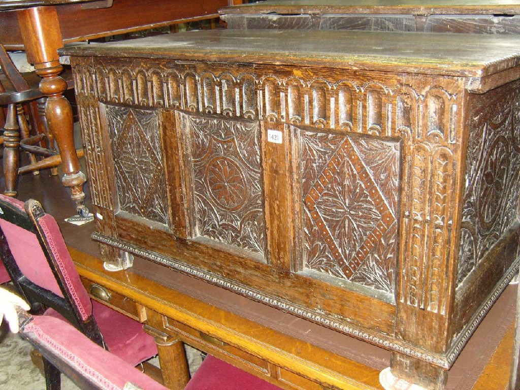 Appraisal: A Georgian oak coffer with carved front elevation