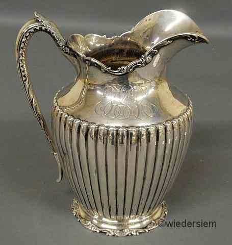 Appraisal: Sterling silver water pitcher by Reed Barton with scroll and