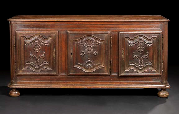 Appraisal: French Provincial Oak Buffet early th century the rounded rectangular