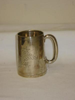 Appraisal: AN EDWARDIAN TANKARD of tapering form with loop handle chased