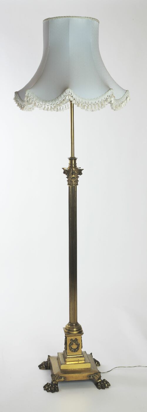 Appraisal: A late Victorian brass adjustable standard lamp with extending column