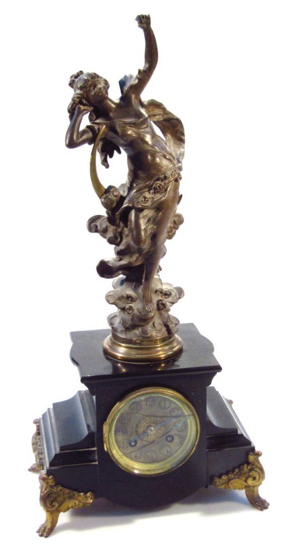 Appraisal: A thC spelter and marble finish mantel clock in the