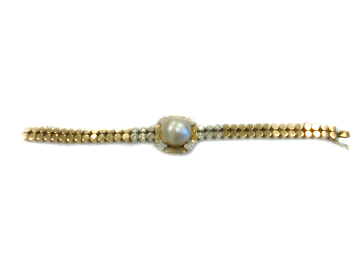 Appraisal: A gold diamond and mabe pearl set bracelet mounted with