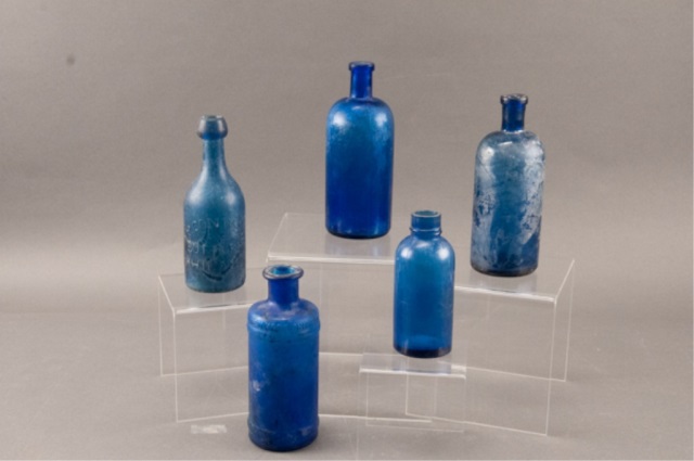 Appraisal: Assortment of Five Cobalt Blue Glass Bottles Varied sizes and