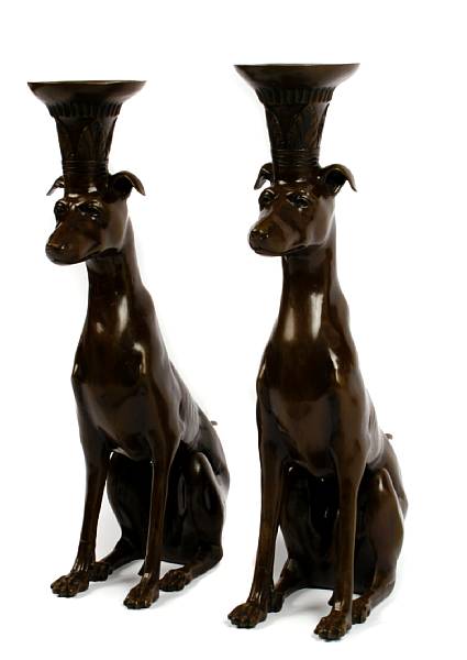 Appraisal: A pair of patinated bronze seated dogs height in width