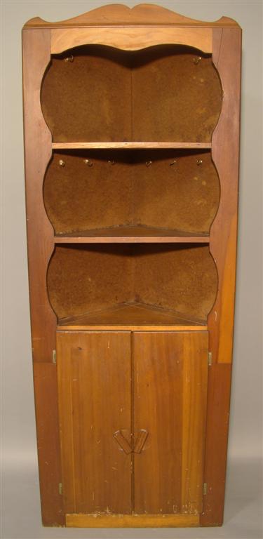 Appraisal: SMALL AMERICAN WOODEN CORNER CUPBOARD The shaped top with three