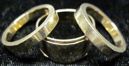 Appraisal: Three karat yellow gold band rings One Krementz one Levin