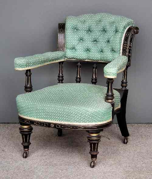 Appraisal: A Victorian ebonised library armchair of ''Aesthetic'' design carved and