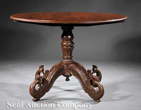 Appraisal: An Antique Anglo-Indian Carved Tropical Hardwood Tilt-Top Breakfast Table mid-