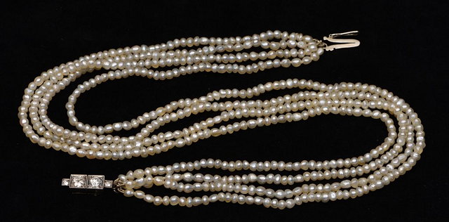 Appraisal: A SEED PEARL NECKLACE in four strands with diamond set