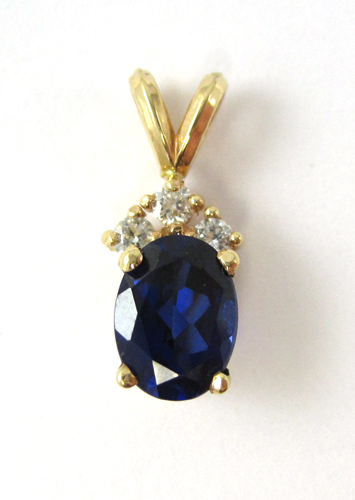 Appraisal: SAPPHIRE AND FOURTEEN KARAT GOLD PENDANT k yellow gold with