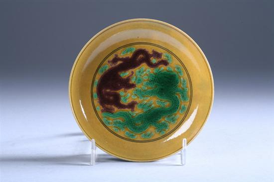 Appraisal: CHINESE SANCAI DRAGON PORCELAIN DISH Kangxi six-character mark Painted with