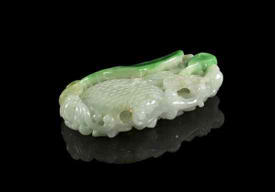 Appraisal: A Jadeite Toggle of a Peanut of white and apple