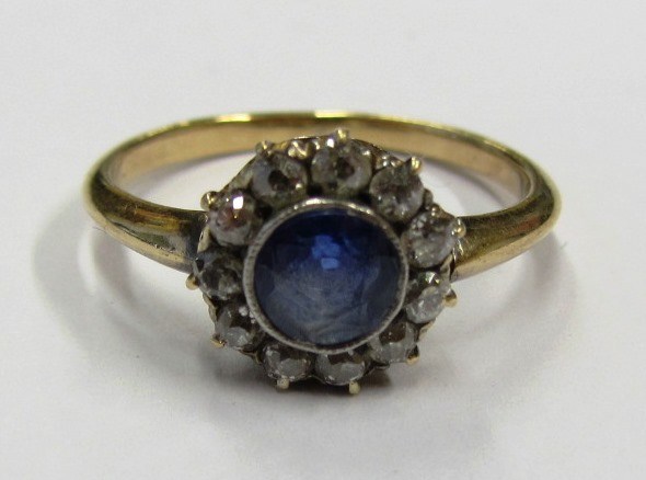 Appraisal: A gold sapphire and diamond set cluster ring mounted with