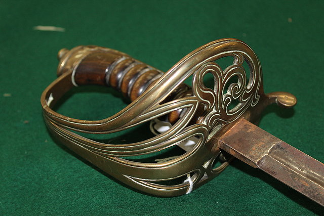 Appraisal: AN OLD OFFICER'S DRESS SWORD with horn grip and pierced