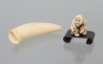 Appraisal: A Carved Ivory Netsuke and a Whale Tooth A carved