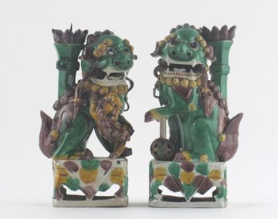 Appraisal: A pair of Chinese biscuit figures of Buddhist lion dogs