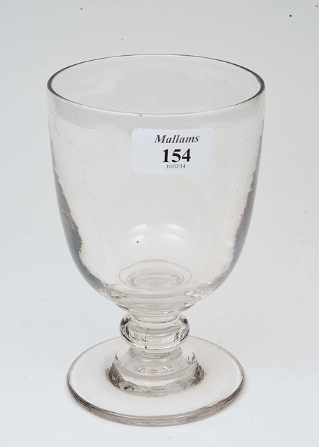 Appraisal: A VICTORIAN GLASS RUMMER with turned stem and circular spreading