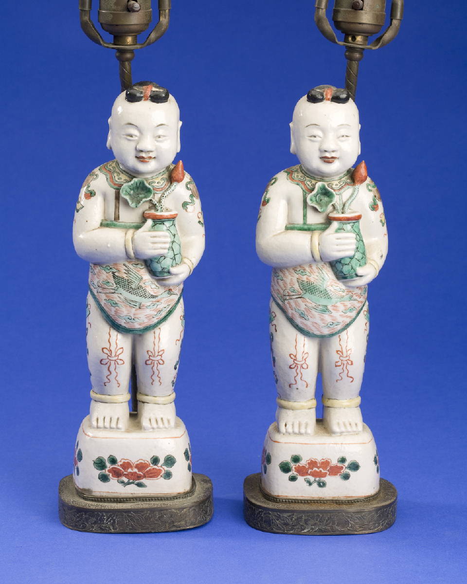 Appraisal: PAIR OF CHINESE EXPORT PORCELAIN FAMILLE VERTE FIGURES OF BOYS