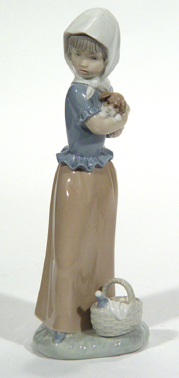 Appraisal: Hand painted Nao porcelain figurine clutching a small dog printed