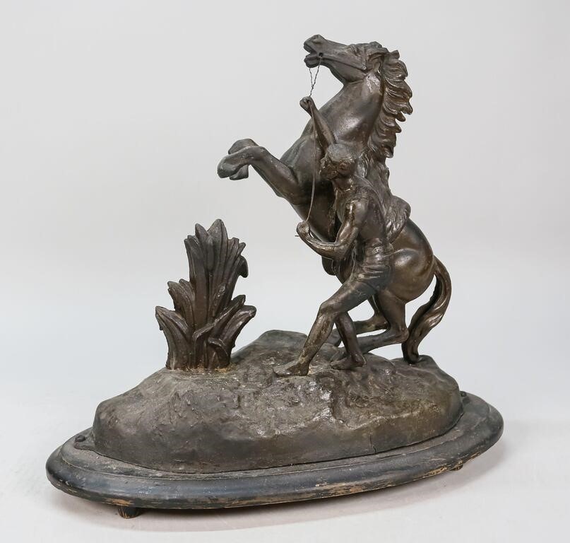 Appraisal: METAL STATUE OF HORSE WITH MAN ON WOODEN BASEMetal statue