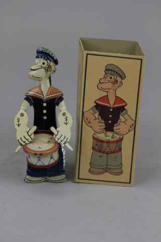 Appraisal: BOXED POPEYE THE DRUMMER Chein lithographed tin classic hand held