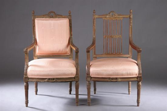 Appraisal: TWO LOUIS XVI STYLE CARVED FRUITWOOD OPEN ARMCHAIRS late th