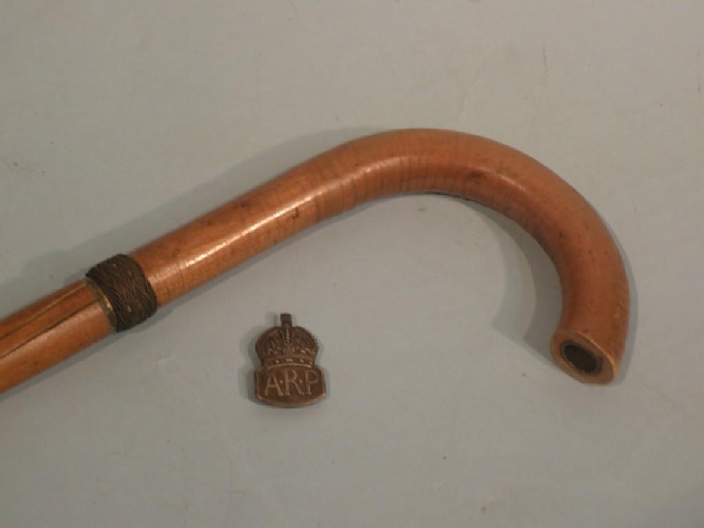 Appraisal: An air raid wardens fruitwood walking stick complete with integral