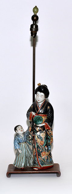 Appraisal: A Japanese Imari porcelain figure groupMeiji period - of a