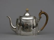 Appraisal: Irish Silver Teapot Large teapot features beautiful hand tooled designs