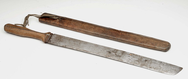 Appraisal: AN AFRICAN PANGA with leather covered hilt and scabbard long