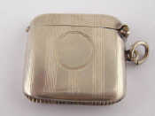 Appraisal: A silver vesta case with ruled decoration and vacant cartouche