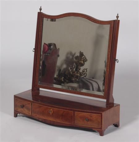 Appraisal: A th century mahogany dressing glass the crossbanded serpentine framed