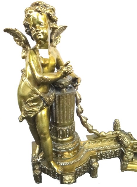 Appraisal: A modern adjustable brass fire curb with putto figural ends