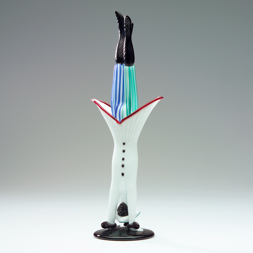 Appraisal: VENINI Meneghino figure performing a handstand in opaque black and