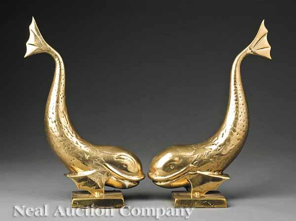 Appraisal: A Pair of English Molded Brass Dolphin Door Stops height