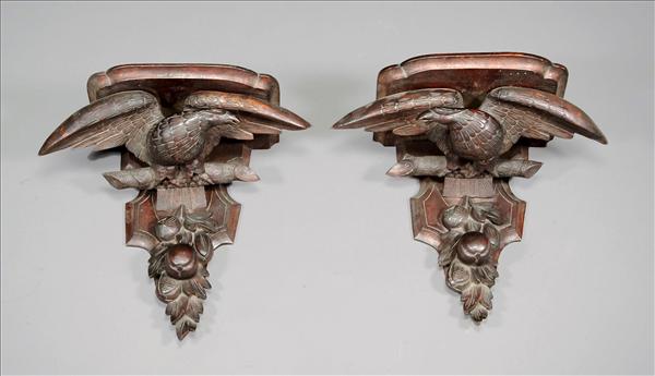 Appraisal: A pair of carved mahogany wall brackets in George III