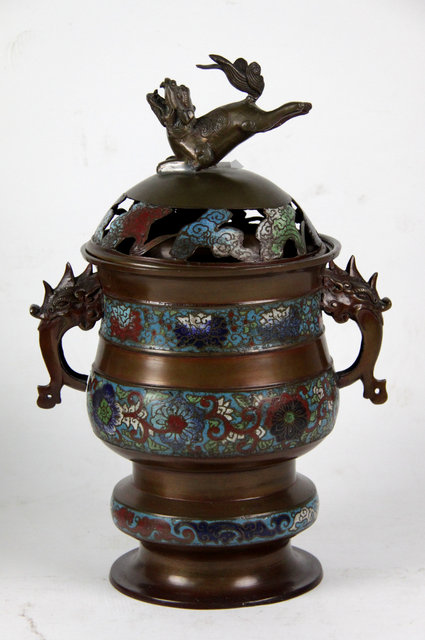 Appraisal: A champlev and bronzed metal koro and cover the pierced