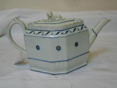 Appraisal: AN ENGLISH PEARLWARE TEAPOT of lozenge section with recumbent lion