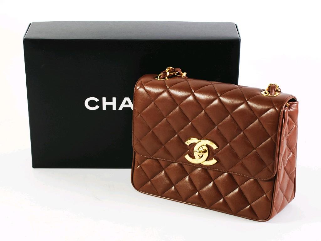 Appraisal: CHANEL LADIES QUILTED LEATHER HAND BAG oblong with gilt metal