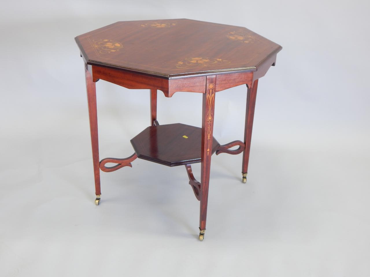 Appraisal: An Edwardian mahogany and simulated and marquetry occasional table the