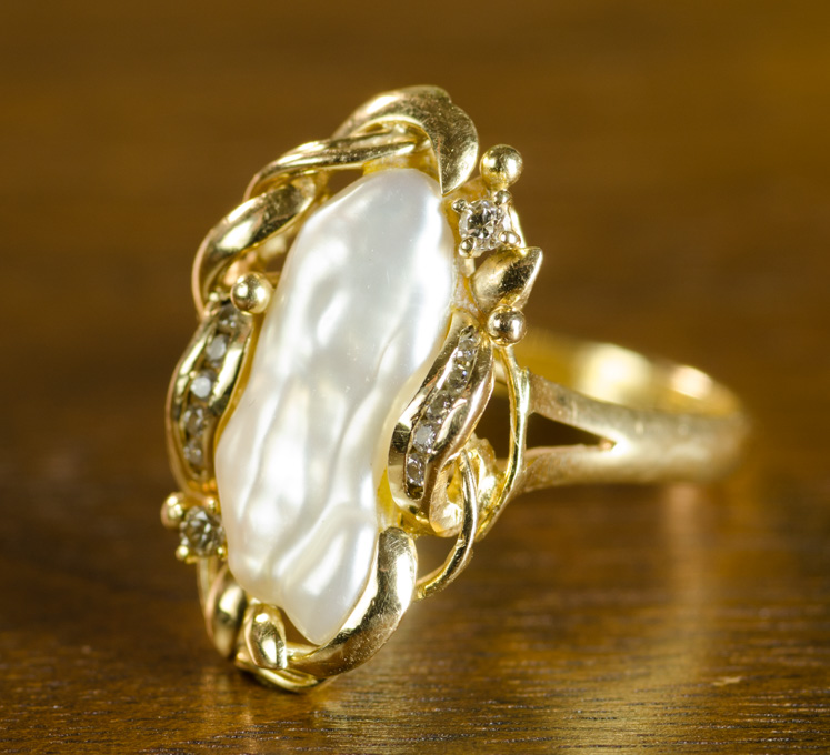 Appraisal: BAROQUE WHITE KESHI PEARL AND DIAMOND RING k yellow gold