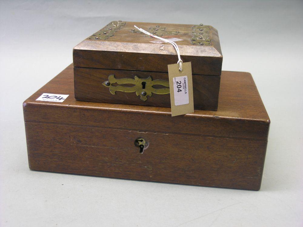 Appraisal: A Victorian mahogany writing box with enclosed baize lined slope